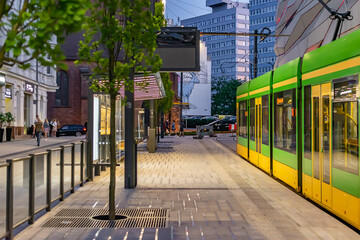 Poznań, Poland -27.05.2023- running greens and yellow trams in Poznań - obrazy, fototapety, plakaty