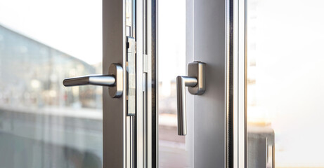 Close up view of aluminum door window, blurry background
