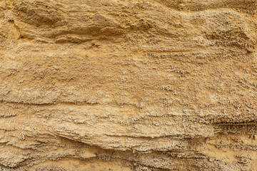 the texture of a natural sand wall covered with sea salt