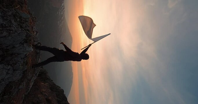 A man waving white flag against sunset dawn. Concept of peace and freedom