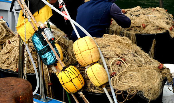 A colorful view of fishing nets and bowies.
