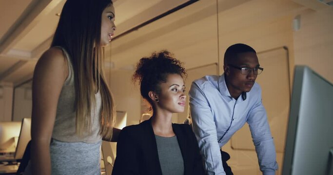 Business people, computer in and training at night in office for creative, help or research. Management, coaching and person team working late online for solution, collaboration or problem solving