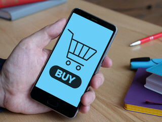 Fototapeta Online shopping concept is shown using the text on the smartphone obraz