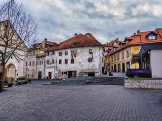 Naklejka na ściany i meble Cobblestone street and old houses in Skofja Loka village, Slovenia