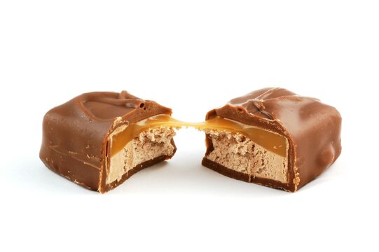 A chocolate and caramel candy bar on a white background
