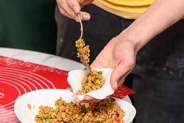 cooking traditional chinese transparent dumplings in the kitchen 52