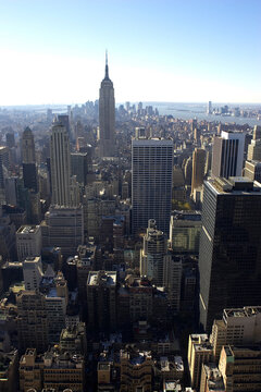 View of empire state building and downtown manhattan from the roof of the rockefeller building, new york, america, usa