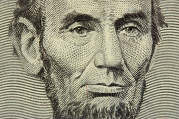 president Lincoln face on the five dollar bill