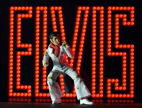 NEW YORK USA, MAY 13 2020: Elvis Presley action figure against a neon background - Mego Corporation action figure