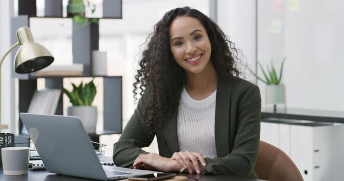 Business woman, face and smile in a office with laptop and happiness from work. African female worker, entrepreneur and young employee portrait at a desk for company website management job with tech