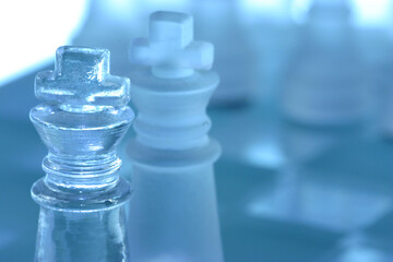 Closeup of two kings in a chess battle.
