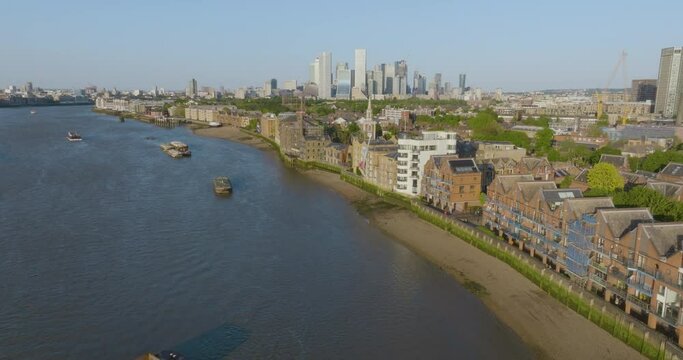 Rising Aerial Establishing Shot Of Canary Warf And The River Thames