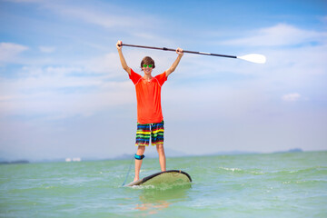 Man on stand up paddle. Water and beach sport