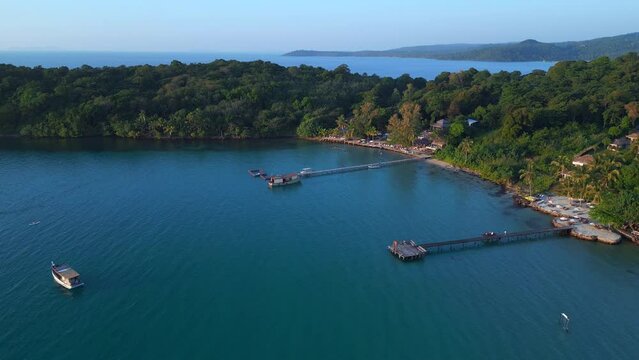 Wooden pier and boats in bay in evening Wonderful aerial top view flight drone
