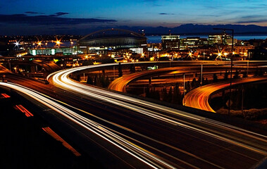 Fototapeta na wymiar Cityscape of Seattle with pattern of headlights and tail lights