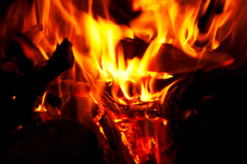 Horizontal close-up of flames and fire on a black background