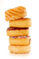 Tower of assorted donuts isolated on white background