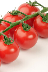 Cherry Tomato's against a plain background