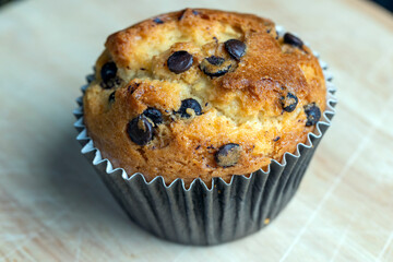 Cupcake with chocolate pieces, close up