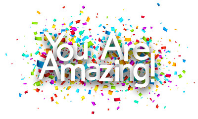 You are amazing sign on colorful cut ribbon confetti background.