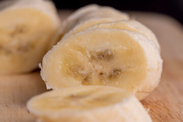 Sliced ripe banana on a cutting board