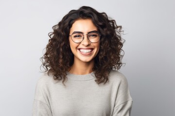Fototapeta premium Portrait of happy young woman in eyeglasses looking at camera