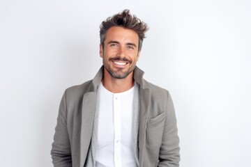 Obraz premium Handsome young man looking at camera and smiling while standing against white background