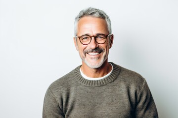 Obraz premium Portrait of a handsome middle-aged man wearing glasses and a sweater
