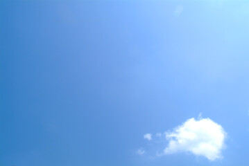 a blue sky with a white cloud