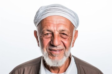 Portrait of a happy senior man in turban on white background