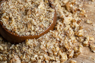 Crushed dried walnuts on the table