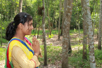 Fototapeta premium Namaste! Portrait of happy Indian Teenage girl village, India