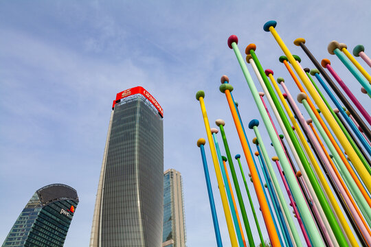 Citylife shopping area with the iconic Three Towers. Torre Allianz "the straight", Torre Generali "the twisted", Torre Pwc "the curved" with the artistic installation "Coloris"