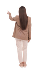 Businesswoman in suit pointing at something on white background, back view