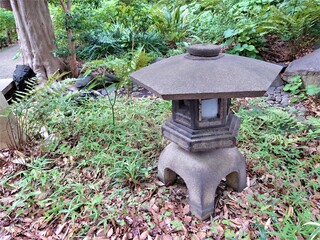old stone object in a garden