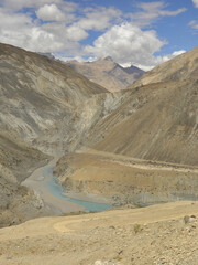 Sangam of the Zanskar and Indus rivers flowing through dry mountains in Nimmu Valley, Ladakh, INDIA. 