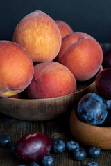 Ripe fresh peaches on a wooden table