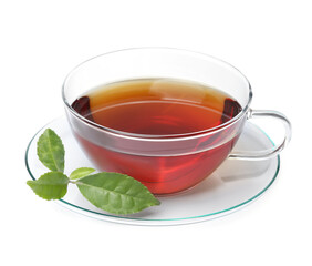 Glass cup of hot aromatic tea and green leaves on white background