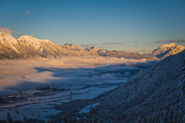 Alpenglow at sunset time on mountain peak at Nassfeld ski resort, Carinthia, Austria. January 2022