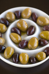 Green and Black olives in a sprial bowl