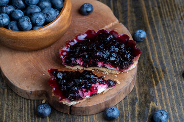 A fresh cake made of buttercream and blueberries