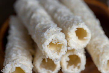 Waffle tubes with butter cream and coconut sprinkles