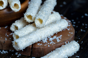 Waffle tubes with butter cream and coconut sprinkles