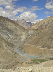 Sangam of the Zanskar and Indus rivers flowing through dry mountains in Nimmu Valley, Ladakh, INDIA. 