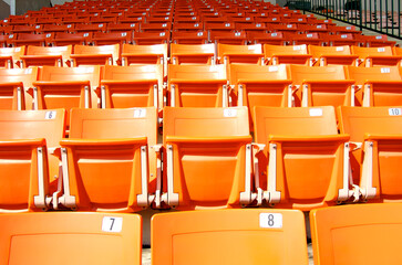 Empty Orange Stadium Seats.  Bangkok, Thailand.