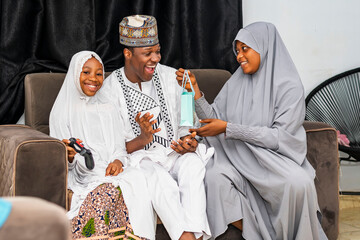 Excited African Muslim family celebrating together
