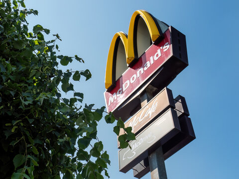 Germany - MAI 29, 2023: Mcdonald's sign in front of a blue sky with no clouds