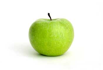 green sour apple against white background