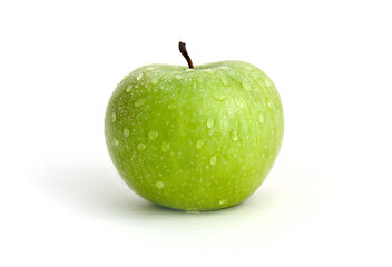 green apple with waterdrops against white background