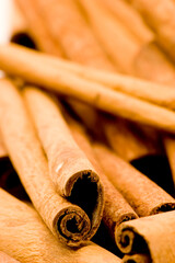 Cinnamon sticks against a plain background